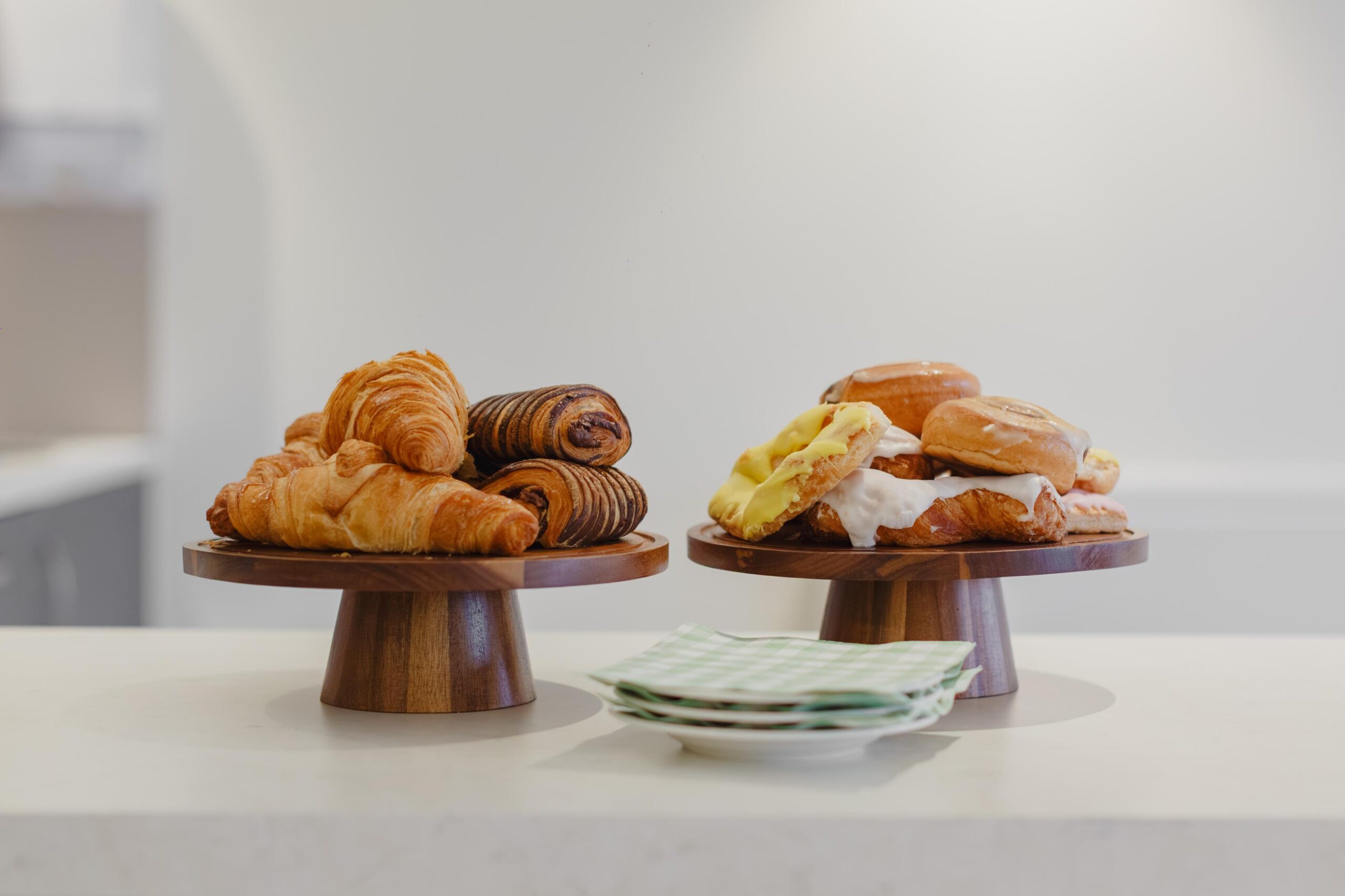 a selection on pastries on cake stands