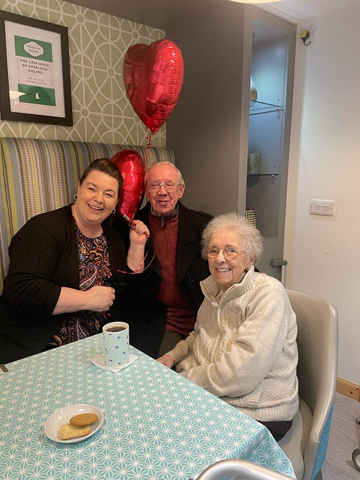 Residents & Staff Member With Valentine's Balloons