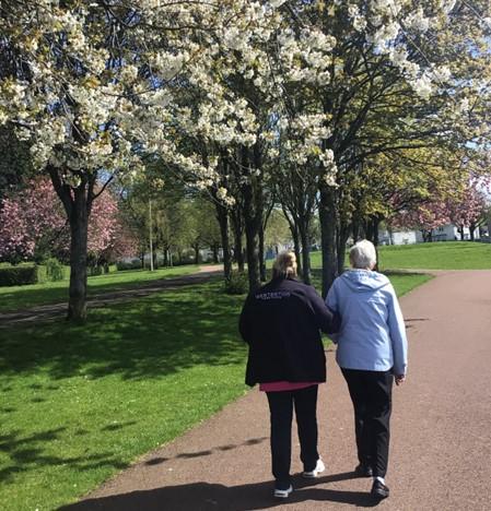 resident-walking-through-blossom