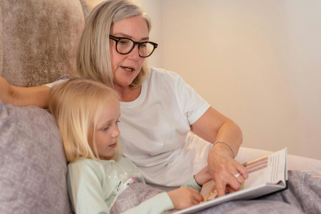 Resident reading a book with a child