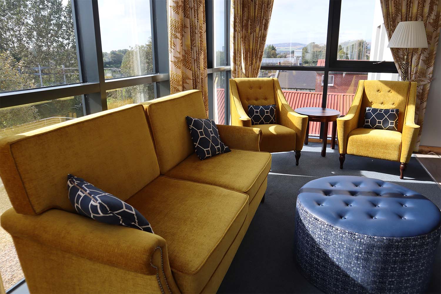 sofas in a sunny communal lounge