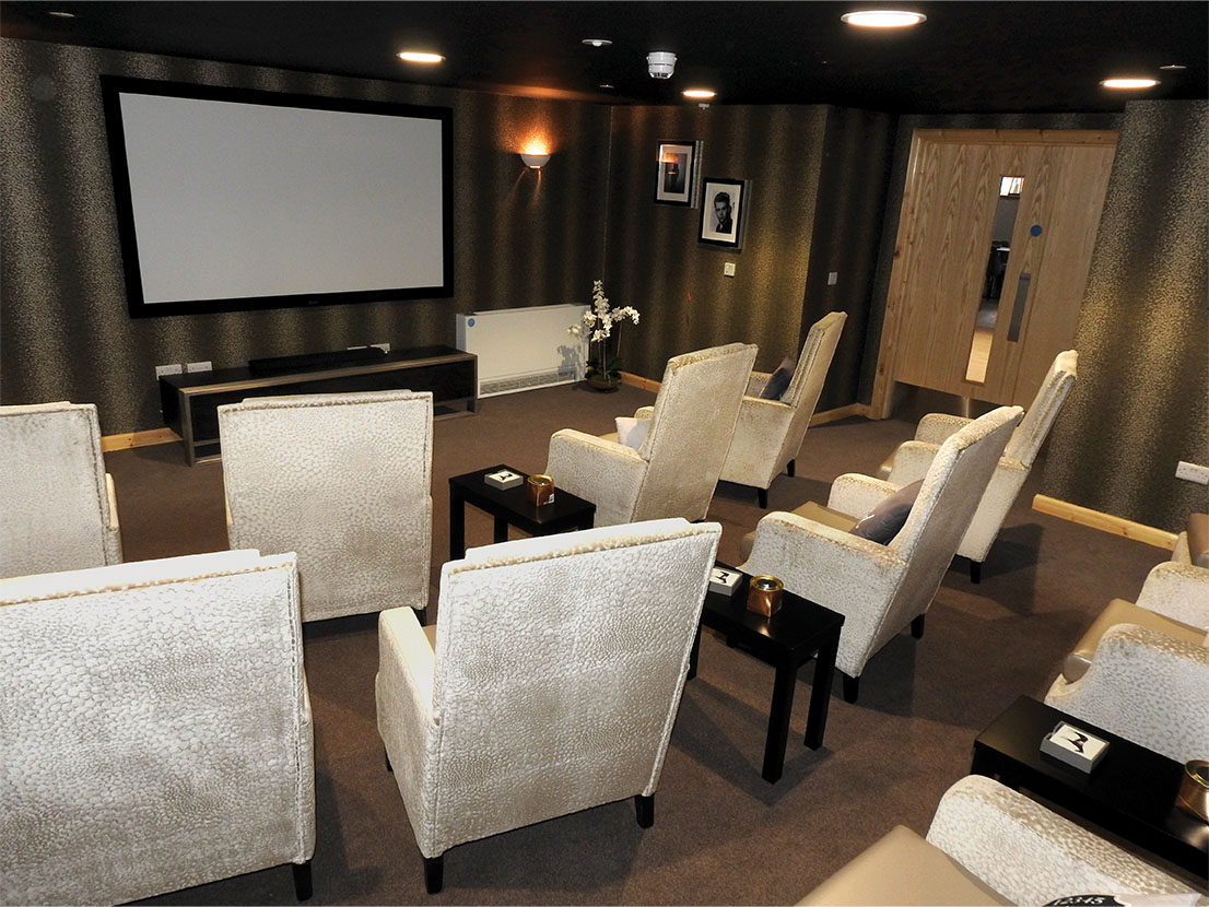 cinema screen and silver armchairs
