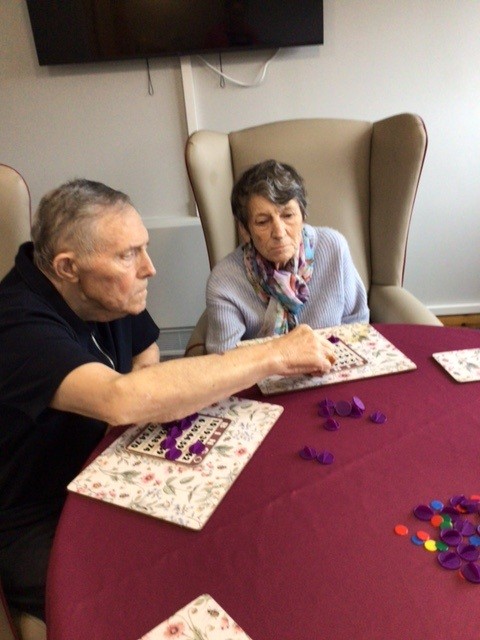 alex and jean playing bingo in westerton care home