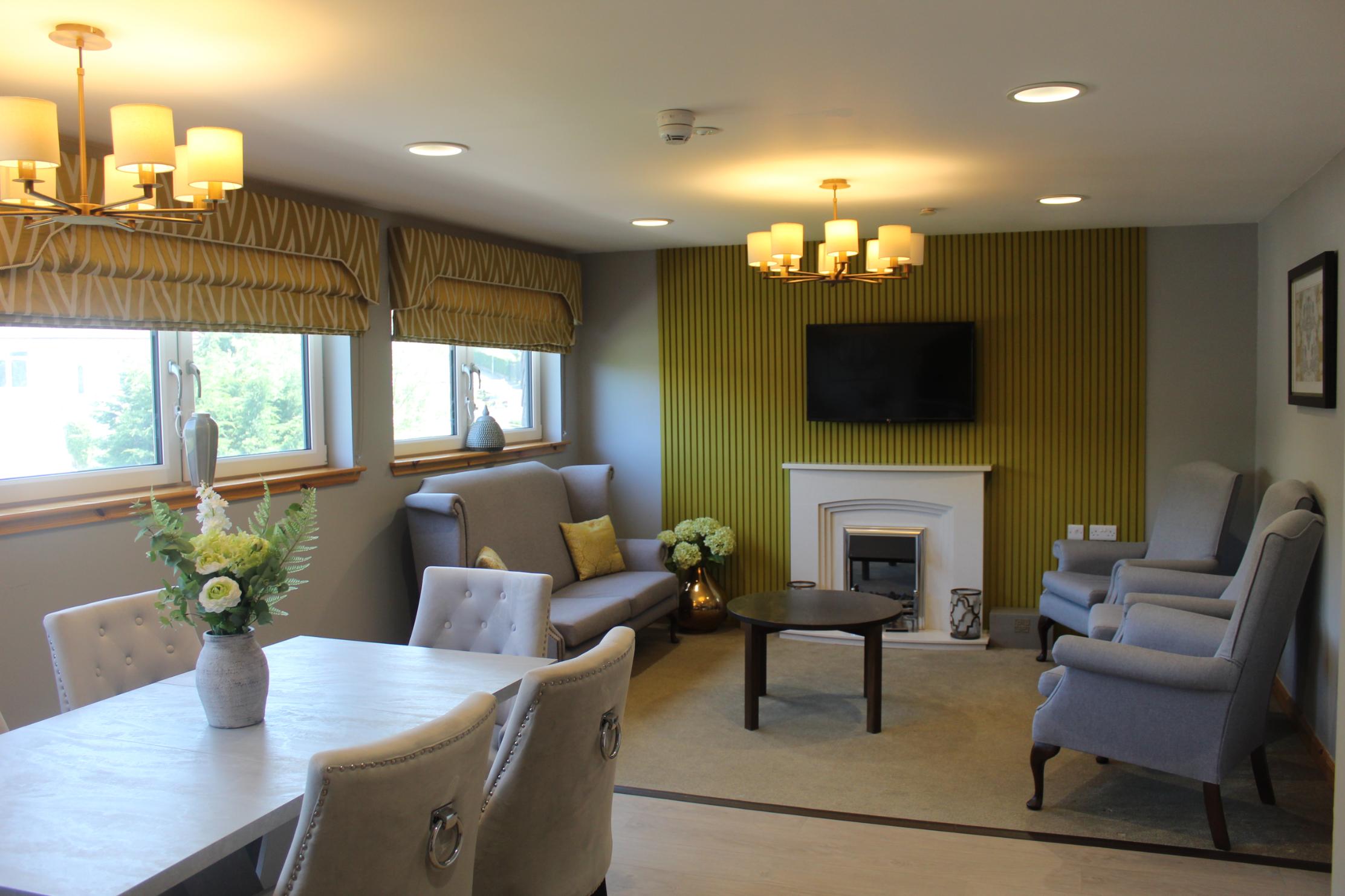 private dining and celebration room with table and armchairs